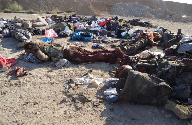 The bodies of rebel fighters are seen on the ground after an ambush by Syrian troops 