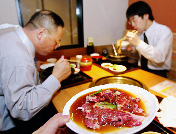 A dish of sliced beef is served at a Kor 