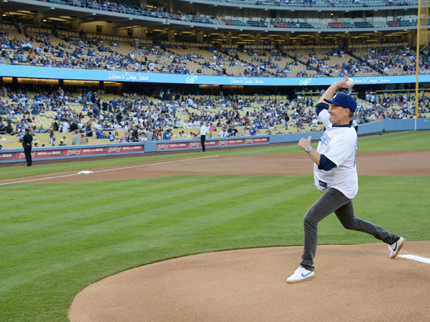 Bryan Cranston throws the first pitch at the Cincinnati Reds versus Los Angeles Dodgers game at Dodger Stadium on July 26, 2013 in Los Angeles. 