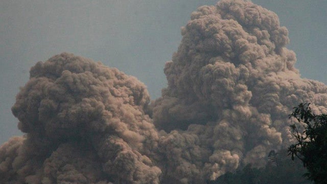 Mount Rokatenda spews volcanic material as it erupts on Palue island, Indonesia, Sunday, Aug. 11, 2013. 