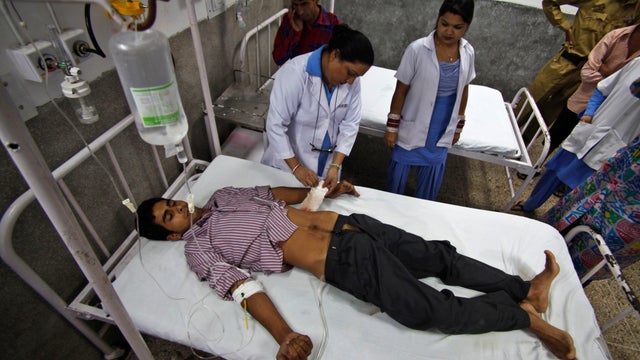 Indian civilian Mohammed Parvez, 25, who was injured in Pakistani firing along the disputed Kashmir border, receives treatment at the government medical college hospital in Jammu, India. 