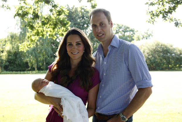 The Duke and Duchess of Cambridge and Prince George pose in early August in the garden of the Middleton family home in Bucklebury, England. 