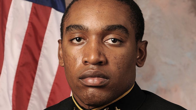 Graduates of the US Naval Academy sing the navy school song during the Naval Academy graduation ceremony at the Navy-Marine Corps Memorial Stadium on May 24, 2013 in Annapolis, Maryland. US President Barack Obama delivered the commencement address. 