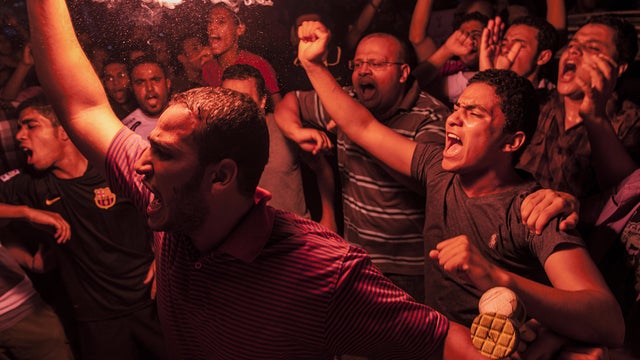 Muslim Brotherhood members and supporters of ousted President Mohammed Morsi light up flares during a demonstration against the military-backed government Sept. 10, 2013, in Cairo. 