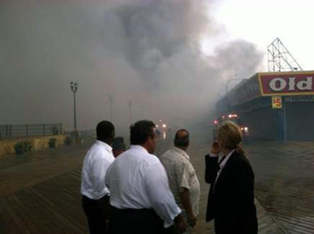 Gov. Christie on the Seaside boardwalk getting briefed by officials 