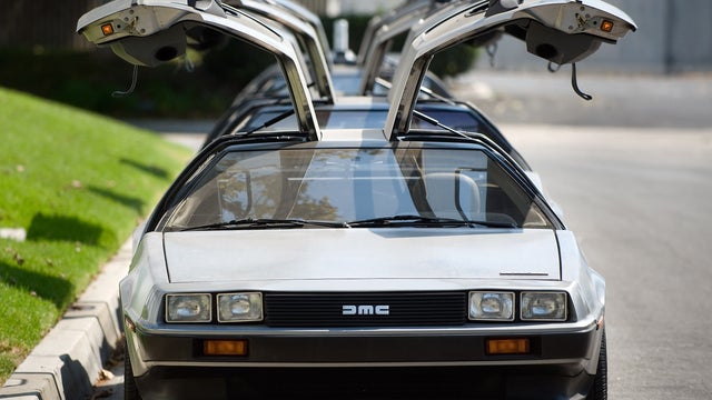 This Sept. 10, 2013 photo shows DeLorean cars parked outside The DeLorean Motor Company in Huntington Beach, Calif.  