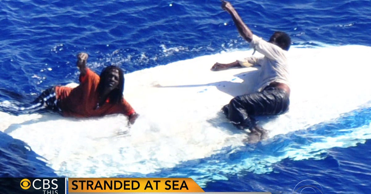 Amazing survival at sea: 2 men cling to capsized boat for more than a ...