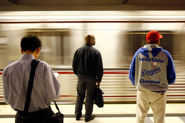 Passengers wait for Metrolink subway trains 