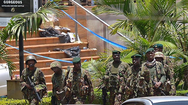 Kenyan soldiers walk outside the Westgate Mall  