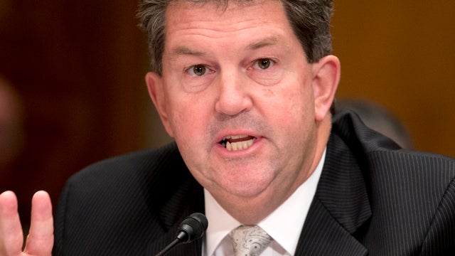 Postmaster General Patrick Donahoe testifies on Capitol Hill in Washington Sept. 26, 2013, before the Senate Homeland Security and Governmental Affairs Committee hearing on reforming the U.S. Postal Service. 