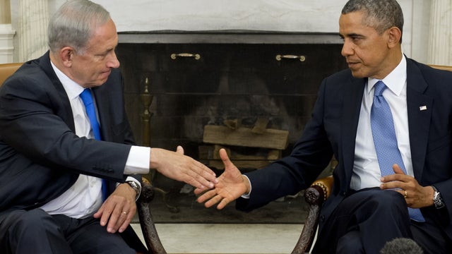 Israeli Prime Minister Benjamin Netanyahu (R) and US President Barack Obama shake hands during a joint press conference at the Prime Minister's Residence in Jerusalem 
