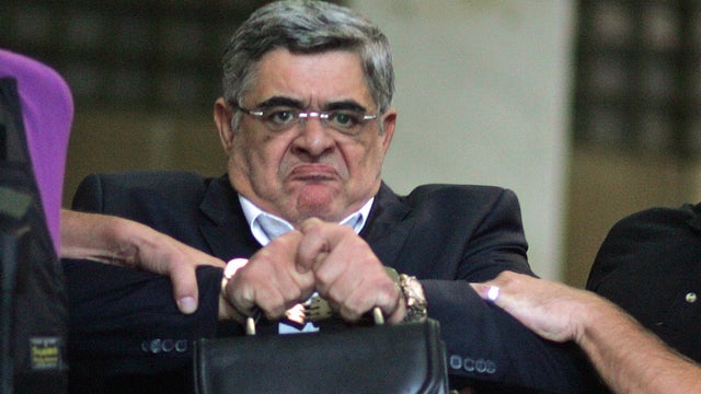 Leader of the extreme far-right Golden Dawn party Nikos Michaloliakos is escorted by anti-terror police 