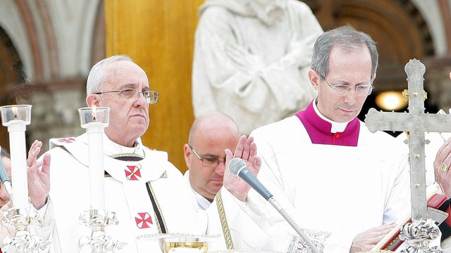 Pope Francis, left, holds a Mass at the Sacro Convento and Saint Francis Basilica 