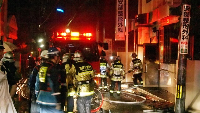 Firefighters attempt to contain blaze at hospital in Fukuoka, Japan on October 11, 2013. The flames killed 10 people, 8 of them patients, and apparently started while patients at the orthopedic hospital were sleeping, police said. 