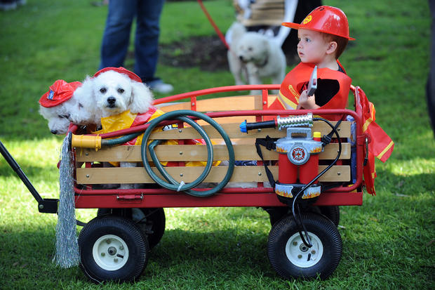 Two-year-old Kyle Lee rides in a wagon w 