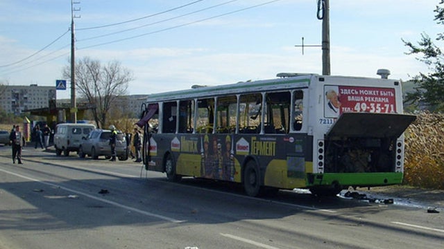 A passenger bus hit by an apparent female suicide bomber is seen on the road in Volgograd 
