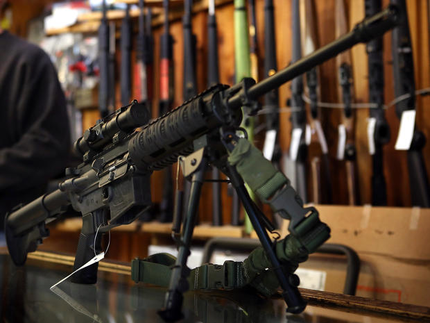An AR-15-style rifle sits on the counter at Freddie Bear Sports sporting goods store Dec. 17, 2012, in Tinley Park, Ill. 