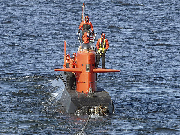 The research submarine NR-1 is towed away from a U.S. naval submarine base in New London, Conn., in February 2007 in this handout picture provided by the U.S. Navy. 