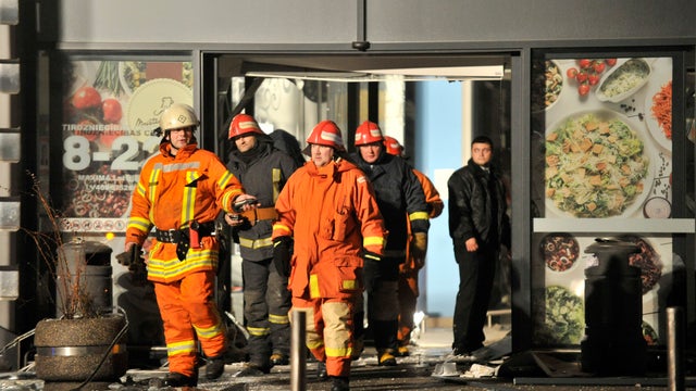 Rescuers work at the Maxima grocery store after its roof collapsed in Riga, Latvia 