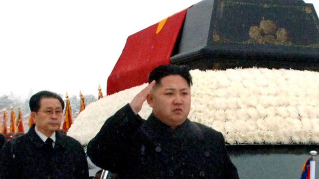 North Korean leader Kim Jong Un, front, and his uncle Jang Song Thaek 