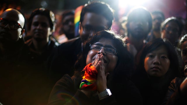 An Indian gay rights activist cries during a protest against a court ruling in New Delhi 