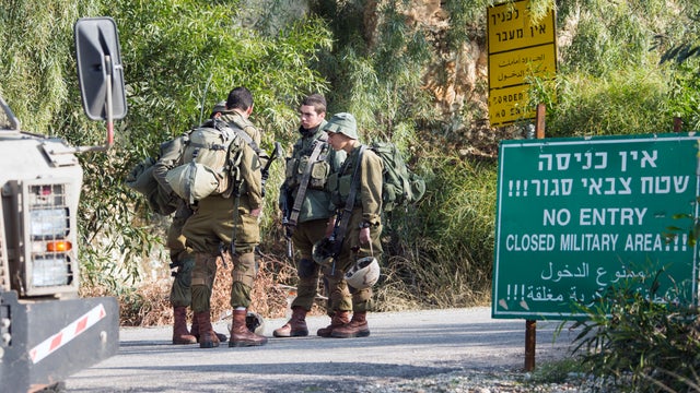 Israeli soldiers control the access of one of the roads near Rosh Hanikra on the Israeli-Lebanese border 