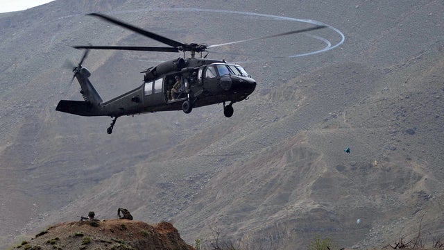 An American UH-60 Black Hawk helicopter prepares to land near in Afghanistan's Nangarhar province 