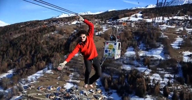Watch: Daredevils walk tightrope 1,200 feet high in the Alps - CBS News