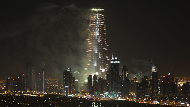 Fireworks explode from the Burj Khalifa, the world's tallest building, at midnight to celebrate the New Year, Jan. 1, 2014, in Dubai, United Arab Emirates 