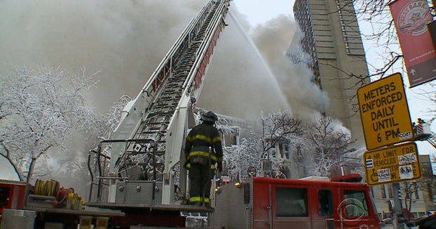Firefighters battle apartment-house explosion in bitter cold - CBS News