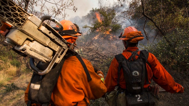 Wildfires burn through California