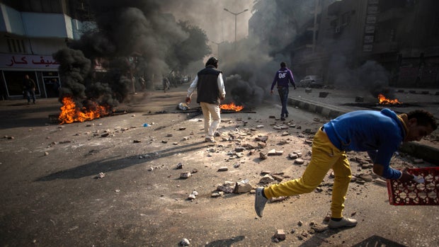 Protesters clash with security forces in the Mohandiseen district of Cairo Jan. 25, 2014. 