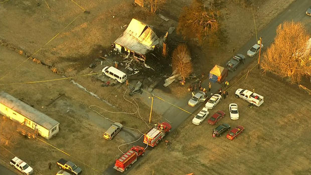 The scene of a deadly house fire is seen near Greenville, Ky., Jan. 30, 2014. 