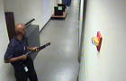 Aaron Alexis moves through the hallways of Building #197 at the Washington Navy Yard in Washington carrying a Remington 870 shotgun Sept. 16, 2013, in this handout framegrab provided by the FBI. 