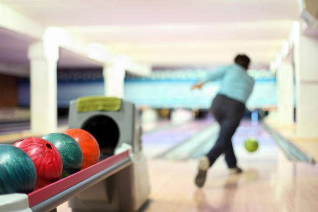 Man in club for bowling throw ball 