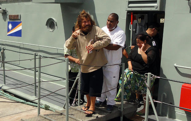 A castaway from Mexico who identified himself as Jose Salvador Alvarenga steps off the "Lomor" Sea Patrol vessel in Majuro, Marshall Islands 