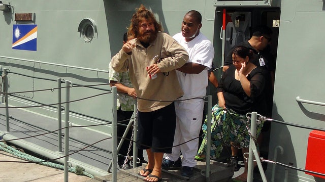 A castaway from Mexico who identified himself as Jose Salvador Alvarenga steps off the "Lomor" Sea Patrol vessel in Majuro, Marshall Islands 