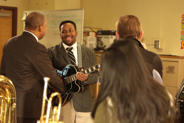 A young musician from Arts High School shares a laugh with Wynton Marsalis 