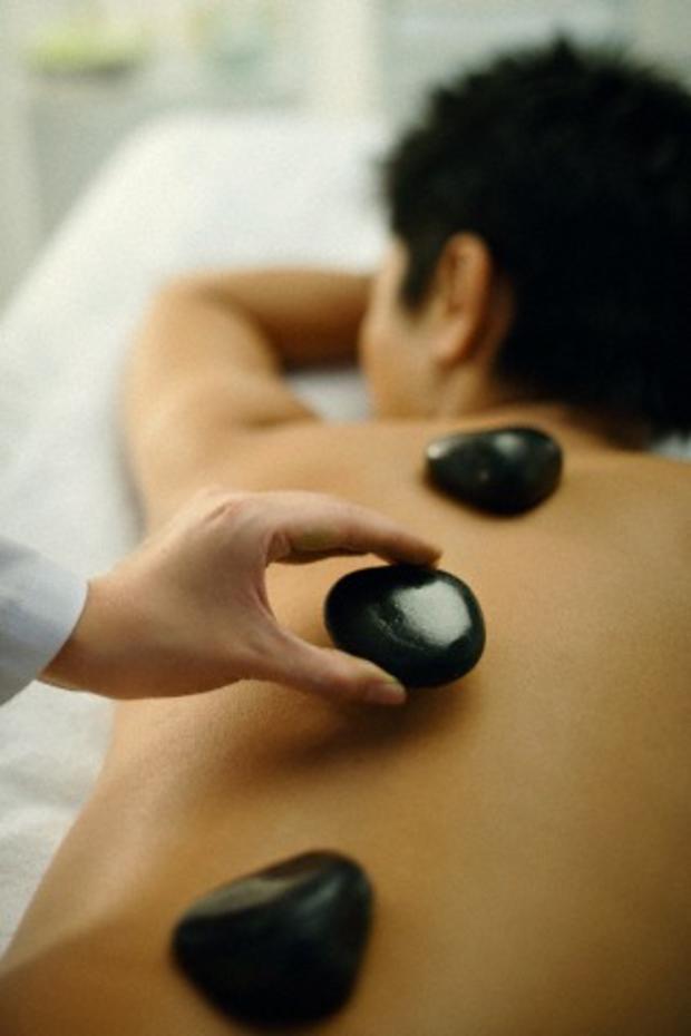 Man getting stone massage 