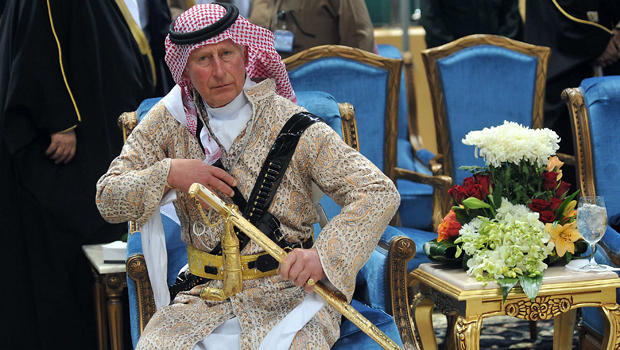 Britain's Prince Charles, wearing a traditional Saudi attire, attends the traditional Saudi dance known as "Arda," which was performed during Janadriya culture festival at Der'iya in Riyadh, Saudi Arabia, Feb. 18, 2014. 