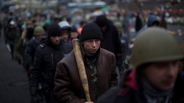 Anti-Yanukovych protesters march in the Independence Square, the epicenter of the country's current unrest, in Kiev 