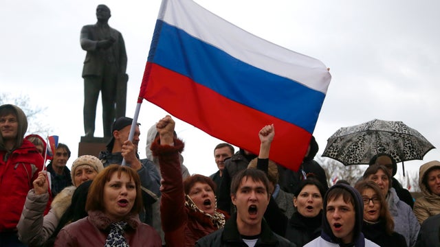 Pro-russian supporters chant slogans during a rally at a central square in Simferopol, Ukraine 