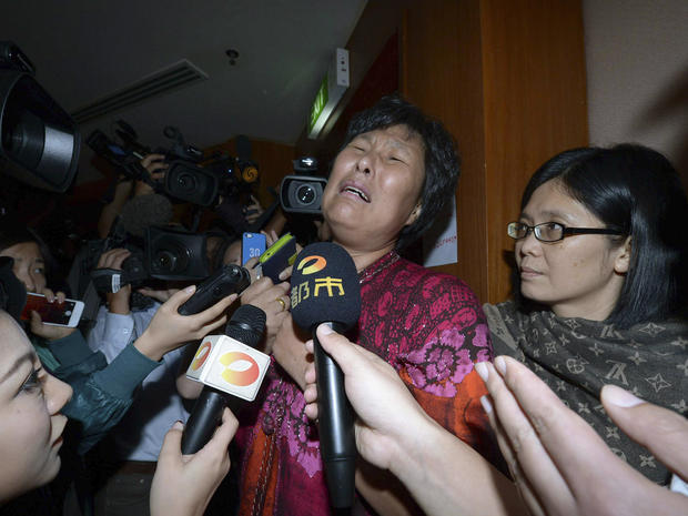 A Chinese relative of passengers aboard Malaysia Airlines Flight 370 cries as she speaks to journalists at a hotel in Sepang, Malaysia, March 19, 2014. 