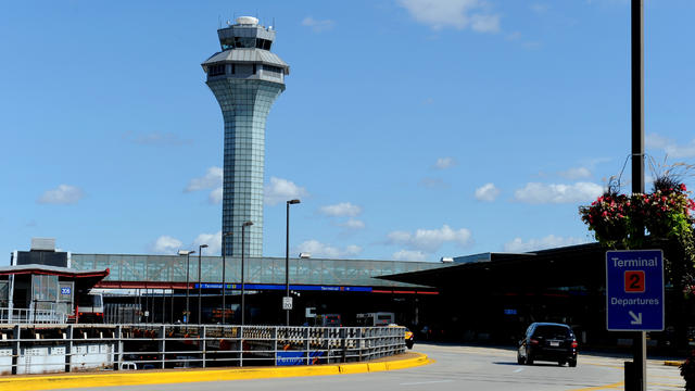 The air traffic control tower is seen behind the departures level of terminal 2 at Chicago's O'Hare 