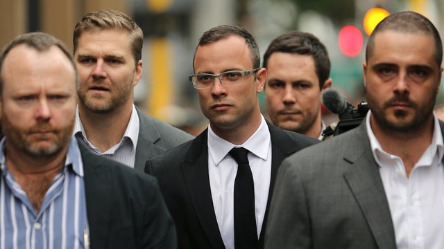 Oscar Pistorius, center, with relatives arrives at the high court in Pretoria, South Africa 