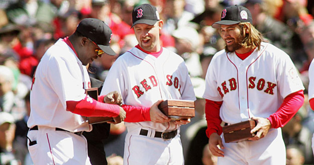 Boston Red Sox catcher Jason Varitek waves to the crowd at Fenway Park as  he walks out to receive his 2007 World Series ring in a ceremony before the Red  Sox home