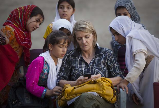 AP Special Regional Correspondent for Afghanistan and Pakistan Kathy Gannon sits with girls at a school in Kandahar 