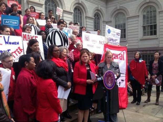Equal pay advocates rally on the steps of City Hall 