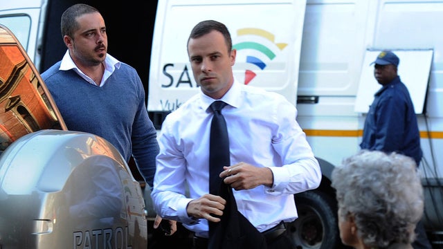 South African paralympic athlete Oscar Pistorius arrives at the high court in Pretoria 