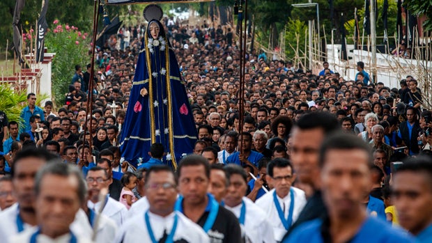Catholic worshipers carry a a statue of the Virgin Mary to transfer it from one church to another during Holy Week celebrations, known as Semana Santa, April 18, 2014, in Larantuka, East Nusa Tenggara, Indonesia. 